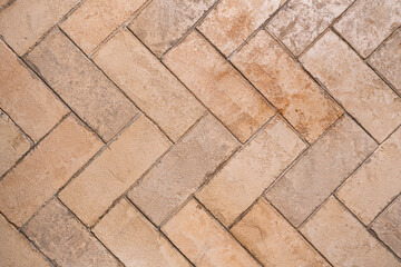 Obraz premium Light brown Stone wall texture. Floor pattern or abstract tile background. Herringbone pattern.