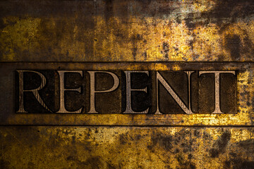 Repent text message on textured grunge copper and vintage gold background