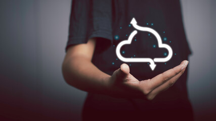 Cloud computing technology concept. Businessman holding digital cloud are currently downloading and uploading data.