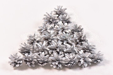 Christmas background of sparkle silver  pine cones