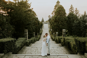 Young newlywed couple walking in the park