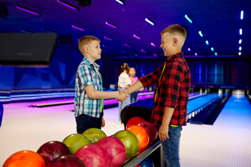 Group of children in bowling alley, little bowlers