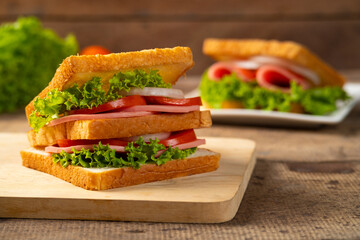 Sandwich bologna sausage with fresh vegetables, tomato, lettuce and onion © Kritchai