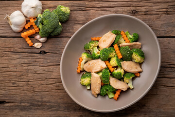 Stir Fried Broccoli with chicken breast and carrot in oyster sauce.Thai food.Top view