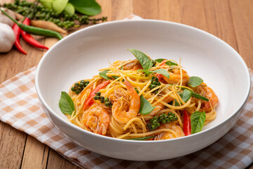 Thai fusion food.stir fried pasta with spicy chilli and shrimp mix with green peppercorn Fingerroot and kaffir lime leaves