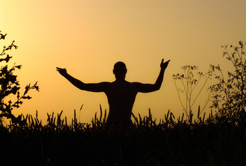 Yoga in the field at sunset