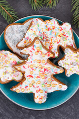 Fresh baked gingerbread with decorations and spruce branches. Christmas time