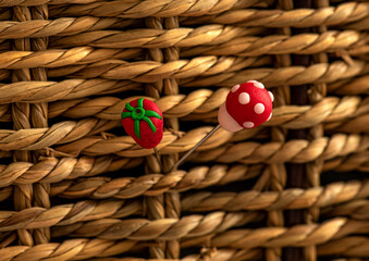 decorative needlepoint with patterns made of felt and threaded sewing needle