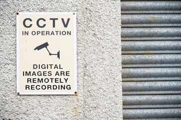 Fototapeta na wymiar CCTV in operation 24 hours premises protected sign