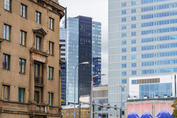 Fototapeta premium Modern glass buildings next to old brick building in central Tallinn Estonia.