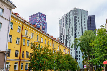Fototapeta premium Modern high-rise buildings next to old residential buildings. Tallinn Estonia.