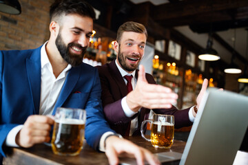 Handsome two businessmen have a meeting in a restaurant