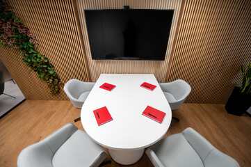 Modern mini meeting table in the office with red diaries on the table