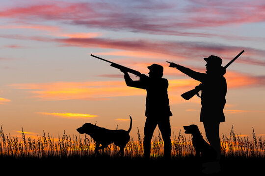 silhouette of hunters at sunset