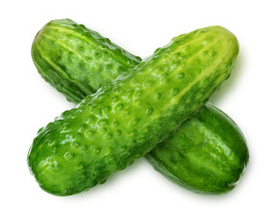 two green cucumbers criss-cross isolated on white background.