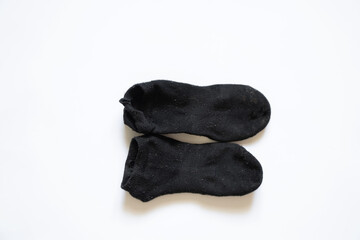 dirty black female socks on a white background, socks