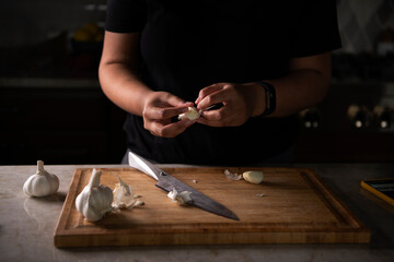 Person peeling garlic 