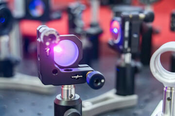 Experiment with laser device in optical laboratory