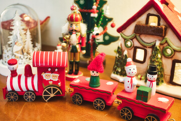 A festive wooden red toy train with elves and snowmen for Christmas