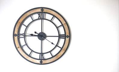 Modern metal and wood wall watch on white background