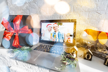video call celebrating christmas by laptop online during coronavirus outbreak
