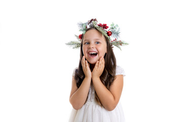 Obraz na płótnie Canvas portrait of cheerful, surprised girl with open mouth in Christmas wreath enjoying Christmas holidays and gifts, isolated on white background. 