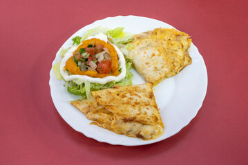 Mexican melted cheese quesadillas with pulled pork and pico de gallo with cream cheese with iceberg lettuce