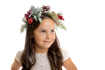 close-up portrait of smiling, beautiful girl in Christmas wreath with decoration looking away with copy space, isolated on white background. 