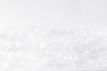White soft light delicate abstract snow texture with snowflakes, closeup, blur band. Abstract winter snowy background.