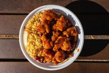 Bowl of Chinese Style General Tso's Chicken with a Side of Fried Rice