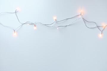 .garland of lights on a light background top view - Image