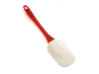 Aerial view of silicone spatula and red plastic handle isolated on white background. Close up of Non-stick rubber spatula for spreading, cooking, baking, mixing food. Cookware