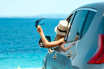 happy driver in car at sea in summer concept freedom and happy