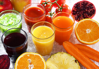 Glasses with fresh organic vegetable and fruit juices