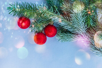 Christmas fir tree with decoration on a wooden board. Copy space. Selective focus.
