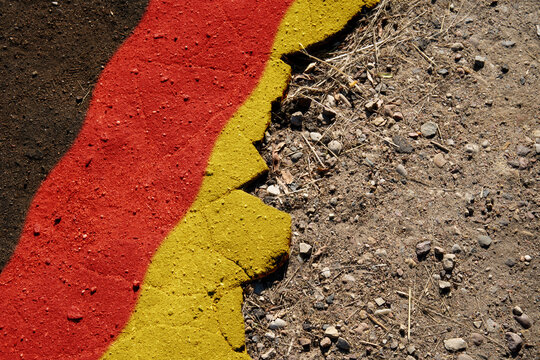 A crisis. Flag on the broken asphalt - Germany
