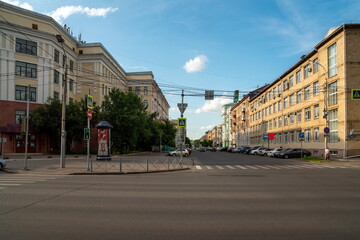 Krasnoyarsk, RF. View of Dekabristov Street from Karl Marx Avenue with the Medical University at the corner on a summer day.