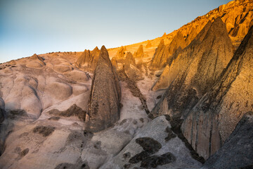 Fototapeta na wymiar Cappadocia at sunset with peaked mountains