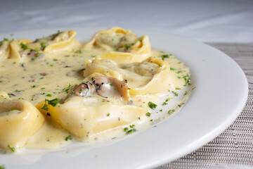 A view of a plate of tortellacci.
