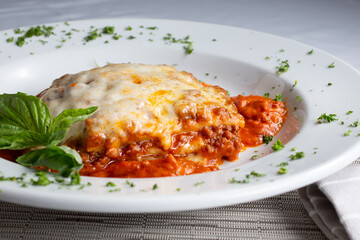 A view of a plate of lasagna.