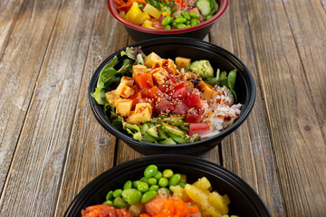 A view of a row of poke bowls.