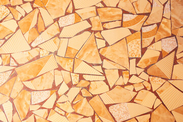 A view of a wall design of broken ceramic plates, as a background.