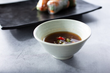A view of a spicy dipping sauce for spring rolls.