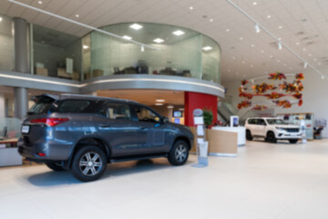 Fototapeta na wymiar car dealership selling premium SUVs, blurred photo