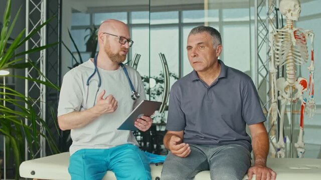 The Doctor Collects a Complete Medical History of the Health Problems of an Adult Male with a Brain Stroke and Conducts a Detailed Physical Examination. Paralysis. Diagnosis and Healthcare Concept.