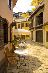 Historic street in downtown with shops and cafes in Old Bar, Montenegro