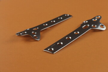 Surgical plates for operations in traumatology