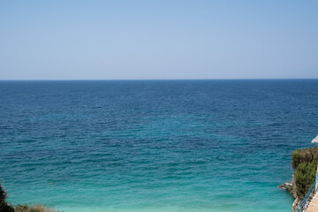Blue and turquoise seawater with clear blue sky in summer at daytime