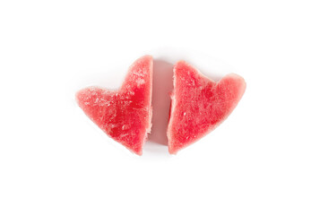 Obraz na płótnie Canvas Frozen fresh tuna steaks in the shape of a heart. Isolated on white background. View from above. Fish food concept