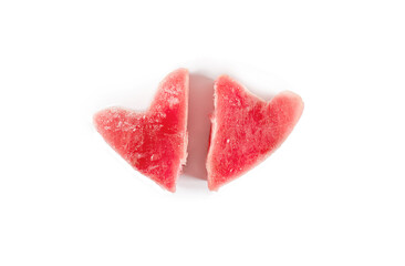 Frozen fresh tuna steaks in the shape of a heart. Isolated on white background. View from above. Fish food concept